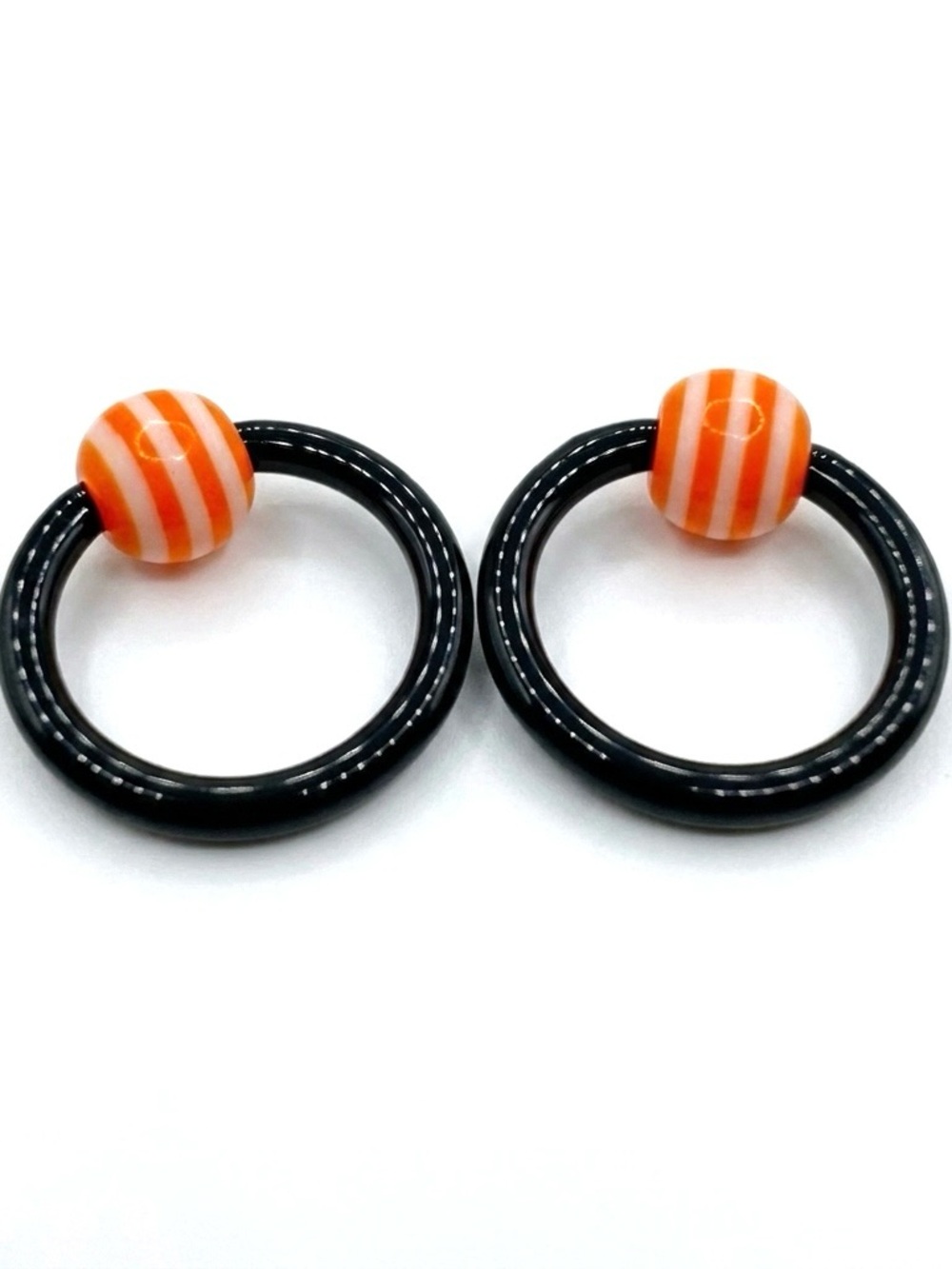 12g 7/16 Captive Bead Ring Pr Black w/ Orange & White Striped Beads